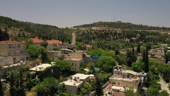 Red roof village in the woody hills, arab village, aerial shot. alt