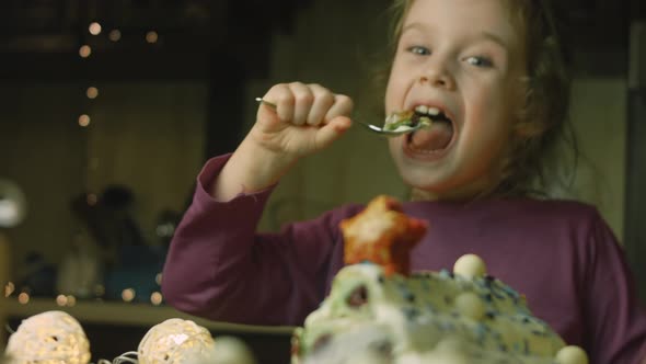 The Girl is Eating Cake with Green Dough Sour Cherries and Sour Cream alt