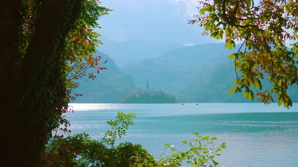 View of Blue Bled Lake and High Mountains Opens From Bank alt