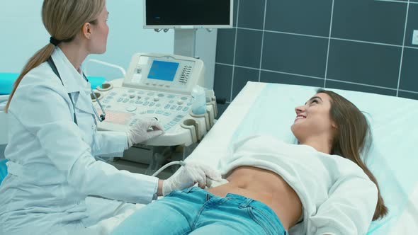 Doctor making ultrasonography for pregnant woman