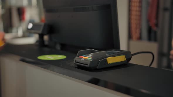 Giving Electronic Terminal Credit and Debit Cards to Pay for the Purchase alt