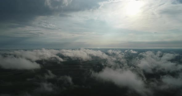 Through The Clouds You Can See The Green Fields From A Bird's Eye View. Agroindustry Ukraine Rivne alt