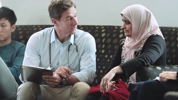 Doctor consulting patient in hospital waiting room