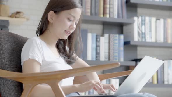 Business young asian woman freelance work and social network online on display laptop computer. alt