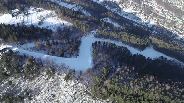 Ski resort and ski slope in mountains during winter season.