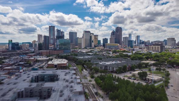 Drone Low Flight Over Residential Area Towards Group of Modern Tall Skyscrapers alt