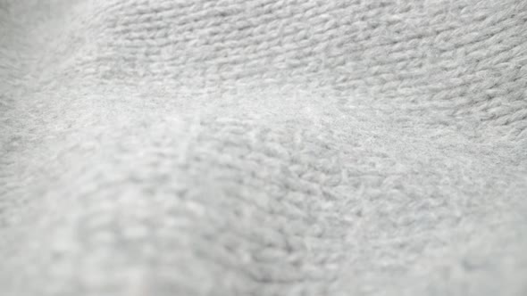Extreme Detail View of Sheep Wool Cloth Texture Flowing in Macro Dolly Shot alt