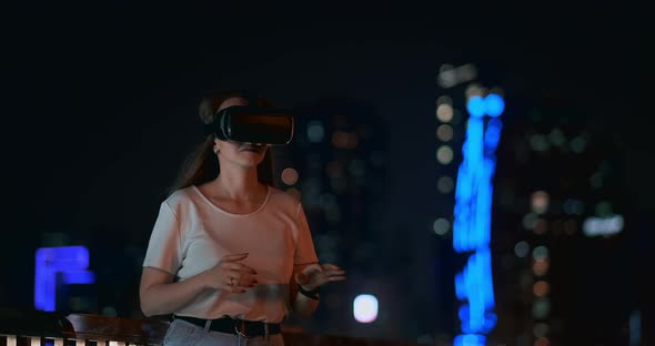 Simulation of Virtual Reality in Glasses in a Modern City in the Evening alt
