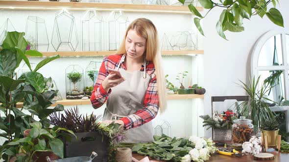 Free Time of Young Florist Female at Work alt
