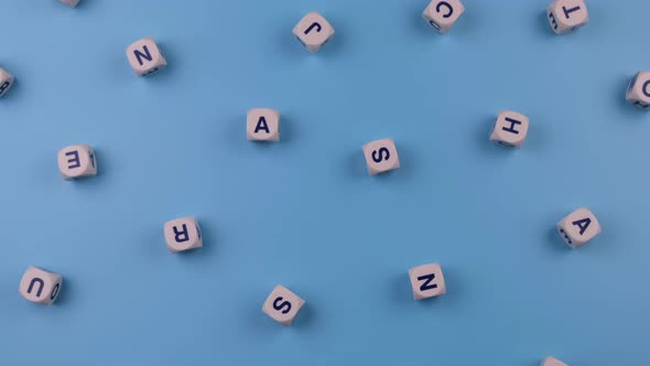 Rotating Cubes or Blocks Word with Letters Randomly on a Blue Background the Concept of a Newborn