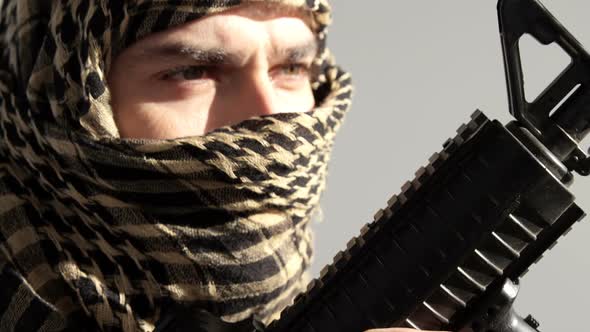 Portrait of soldier holding rifle alt