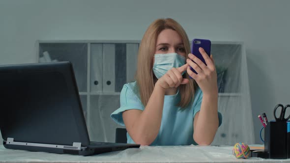Health Protection Young Woman Office Worker in Protective Medical Mask Works in Quarantine and Uses alt