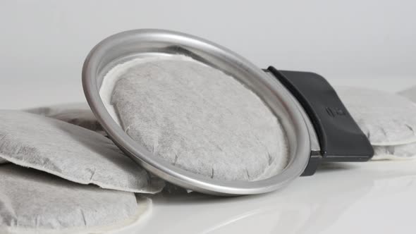 Putting coffee pod on holder close-up 4K footage alt