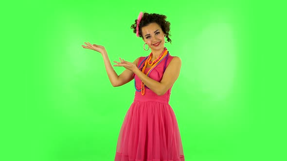 Woman Pointing Side Hand for Something and Shows Thumb Like Then Nods Disapprovingly. Green Screen alt