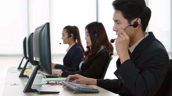 Business People Wearing Headset Working in Office alt