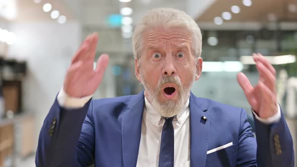 Upset Senior Old Businessman Reacting To Failure  alt