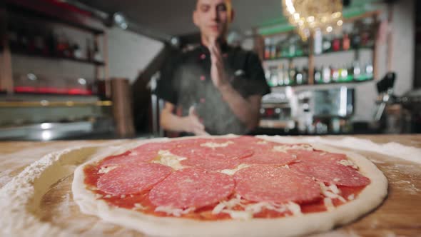 Close Up of Ready Pizza with Sauce Cheese and Sausage alt