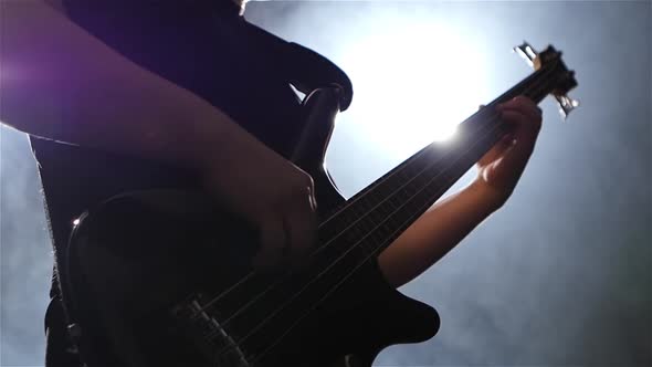 Bottom View. Grif Guitar with Strings. Musician Plays Music alt