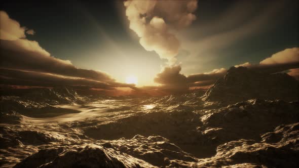 Sun Rays Over Mountains in a Valley alt