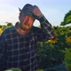 Overworked Elderly Farmer in Plaid Shirt Touching Forehead and Looking Away - VideoHive Item for Sale