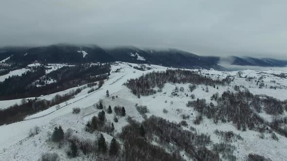 Aerial Drone View Flight Over Winter Mountain Forest alt