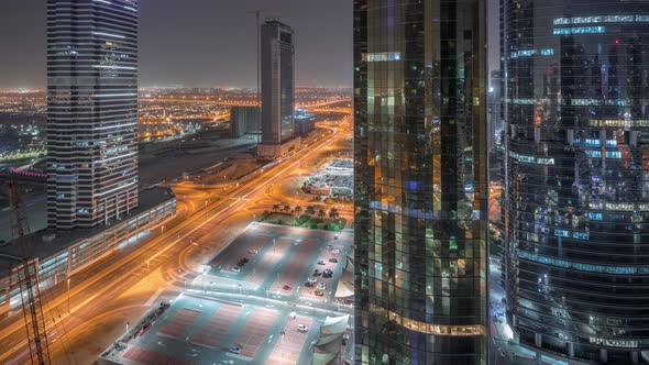 Office Buildings in Jumeirah Lake Towers District Night Timelapse in Dubai alt