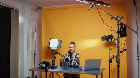 Content Creator Recording an Episode About V Mount Batteries alt