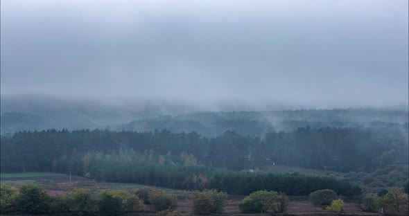 Fog Moving Over the Forests in the Autumn
