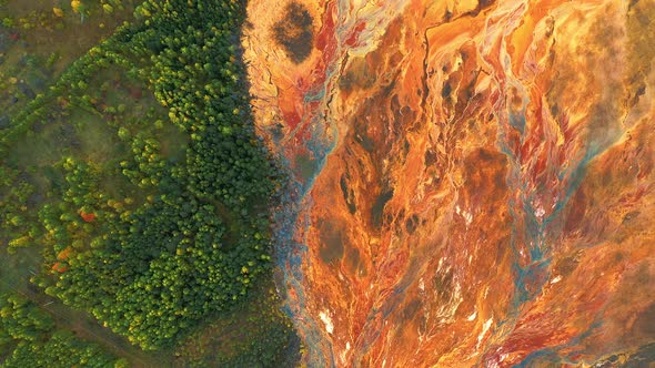 Lifeless Orange Toxic Lake Near Forest Industrial Plant Pollutes Soil and Forest alt