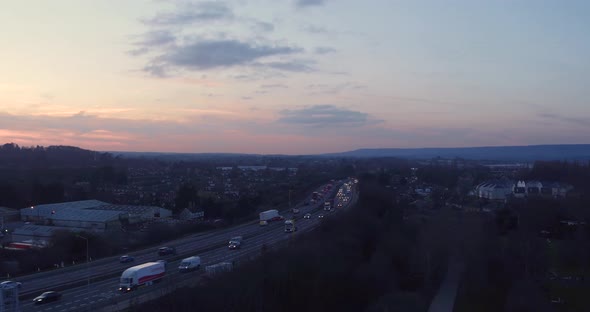 Aerial view of M20 motirway, near Aylesford in Kent, UK at sunset during rush hour. alt