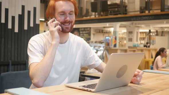 Redhead Beard Man Talking on Phone, Attending Phone Call alt