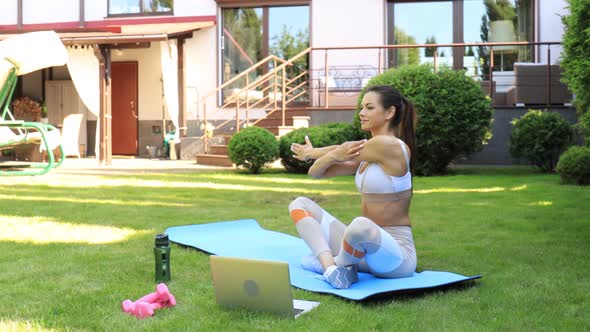 Fitness beautiful slim woman doing fitness stretching exercises outdoor at home. Sport, healthy life alt