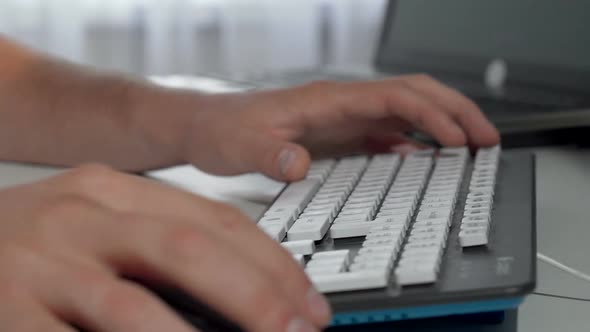 Male Hands Typing on Computer Keyboard alt