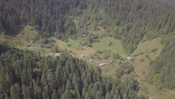 Aerial summer view to Carpathian village Kryvorivnia amidst mountains