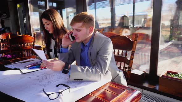Students Calling Professor By Smartphone and Working with Architecture Project