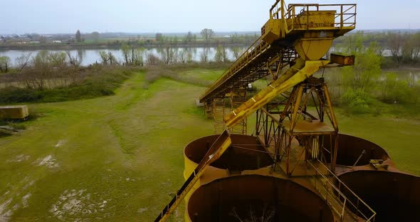 Steel Conveyor Belt with Rusty and Abandoned Containers alt