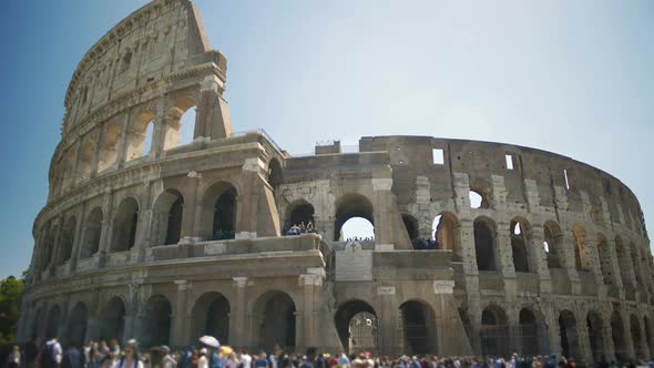 Tourists Walking Near Ancient Amphitheater Coliseum in Italy, Enjoying Tour alt