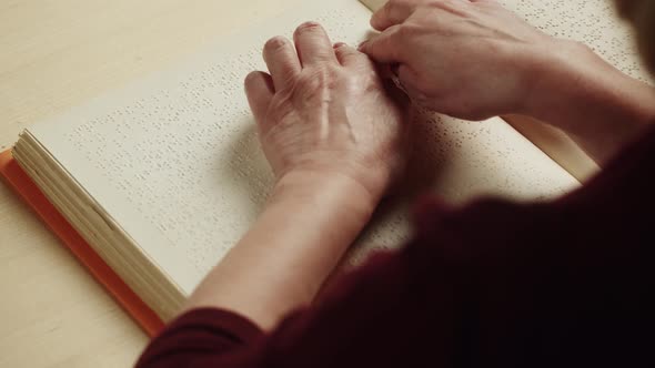 Blind Woman Reading Braille Book Top View Poorly Seeing Female Person Learning to Read Home alt