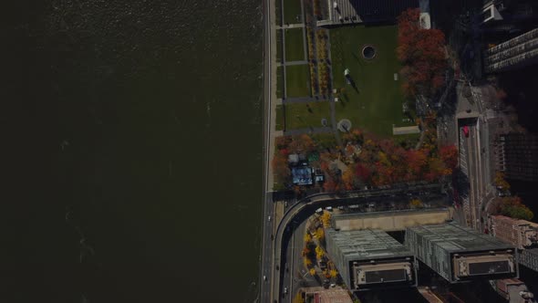 Aerial Birds Eye Overhead Top Down View of River Waterfront and Busy Road Tunnel Under United alt