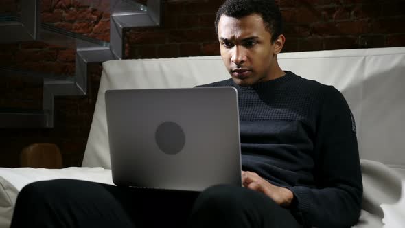 Shocked Man, Amazed by Surprise and Wonder on Laptop alt