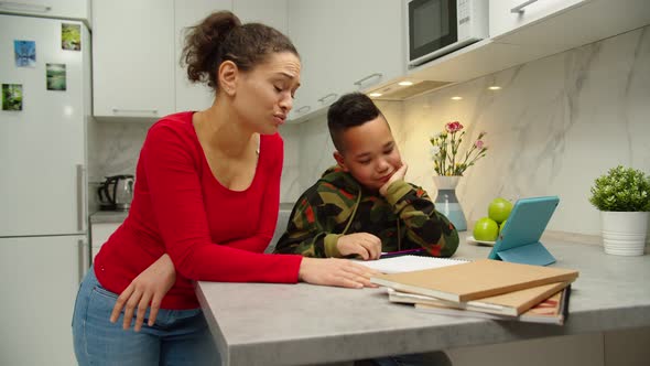 Stressed Woman Scolding Child for Poor Schooling at Home alt