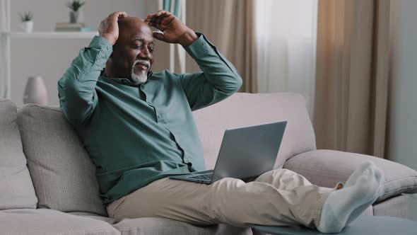 Bald African Bearded Age Elderly Mature Senior Man Freelancer Finish Typing Laptop Working Takes alt