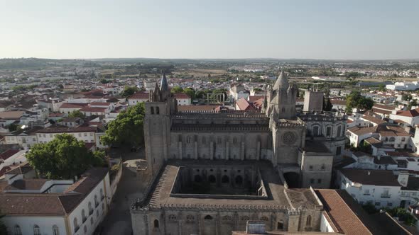 Evora Cathedral with beautiful courtyard. Aerial pullback revealing cityscape.