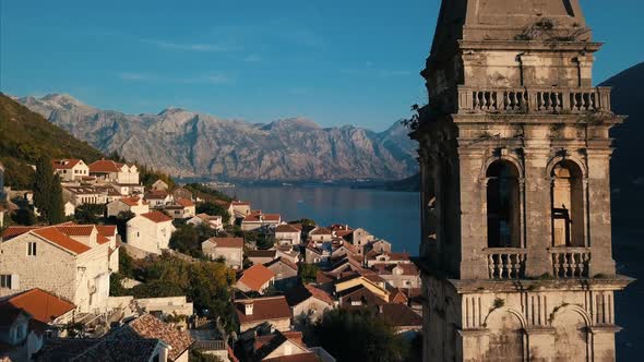 Aerial View Of The Church In Perast Town   Montenegro Cinematic Color alt