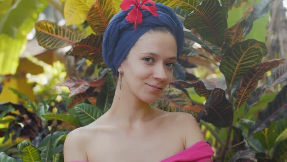 Close Up Portrait Of Beautiful Young Girl In Turban On Nature Background. Charming Sensual Woman