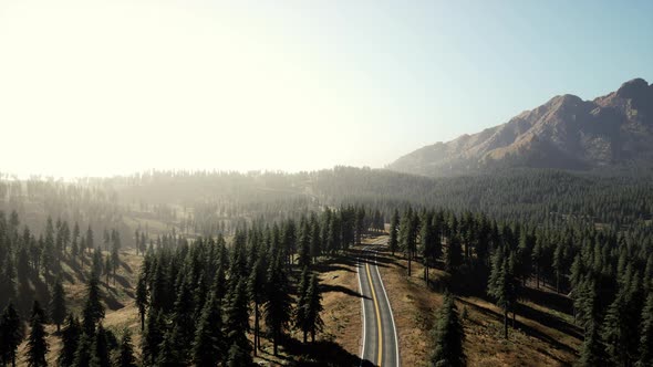 Aerial View of the Old Road Going Through Pass in the Swiss Alps alt