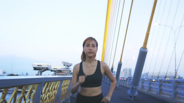 Young Athlete Running on Bridge alt