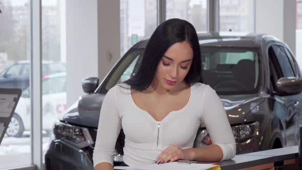Beautiful Woman Smiling, Holding Up Her Car Keys After Buying New Auto alt