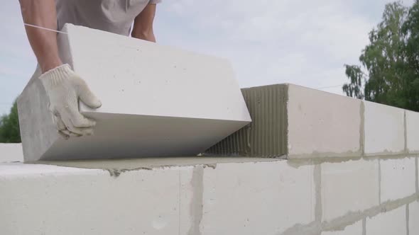 bricklayer, the builder lays bricks or blocks using a stretched rope alt