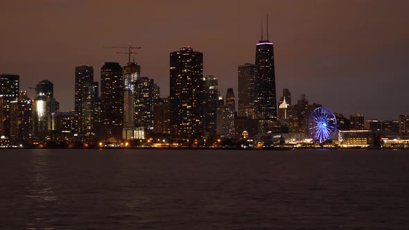 Chicago Navy Pier Ferris Wheel and Waterfront Downtown Buildings at Night alt